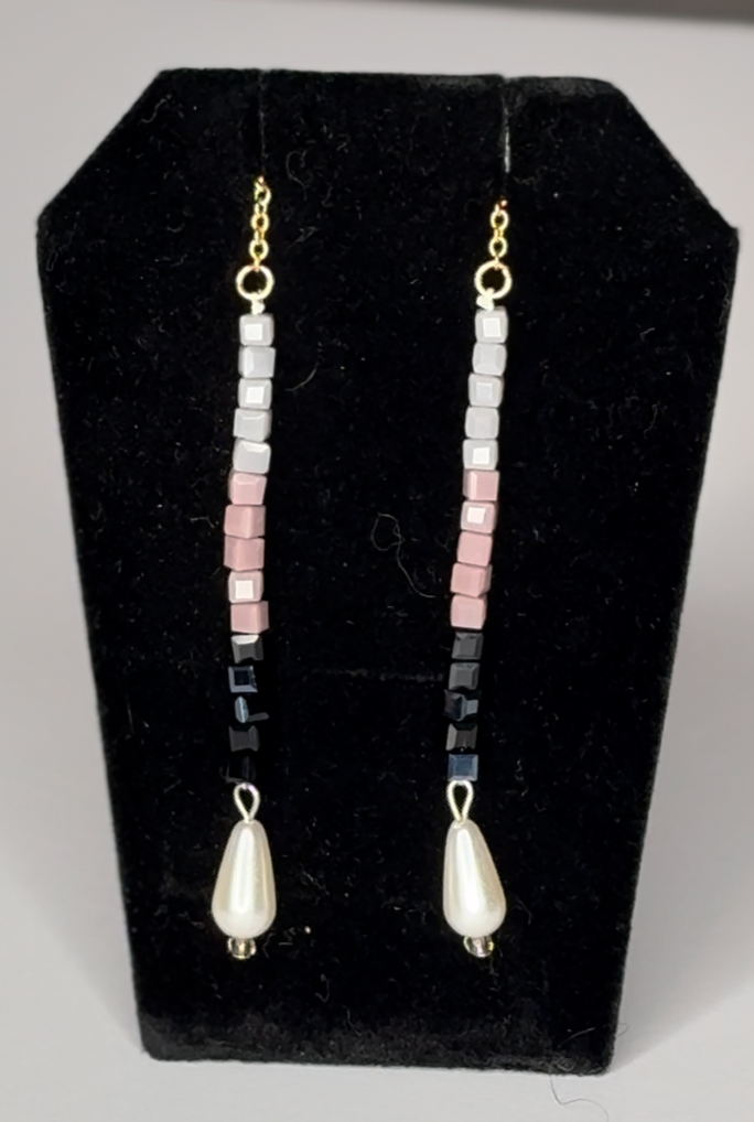 Pair of pearl drop earrings with black mauve and moth color glass cubic beads.